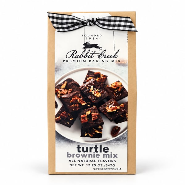 Box of turtle brownie mix with a black-and-white ribbon bow