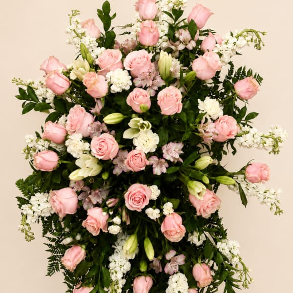 Large pink and white floral standing spray with roses and lilies