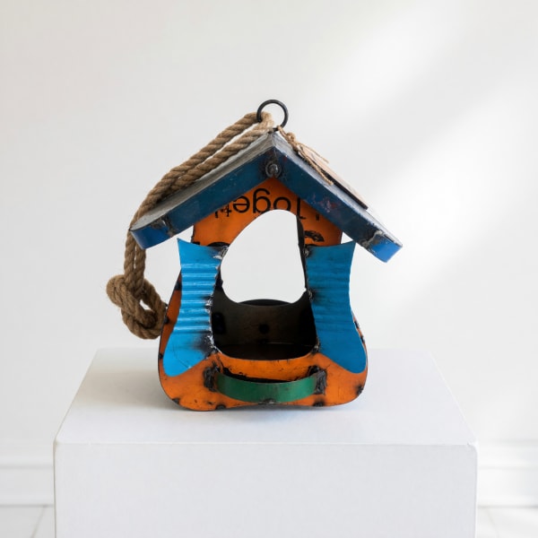 Painted wooden birdhouse with a rope hanger