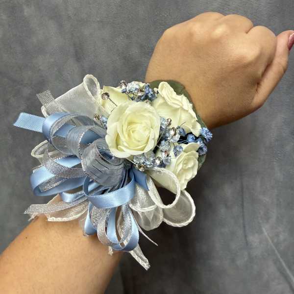 Dusty blue white spray roses corsage