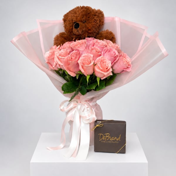 Pink rose bouquet with a teddy bear and chocolate box
