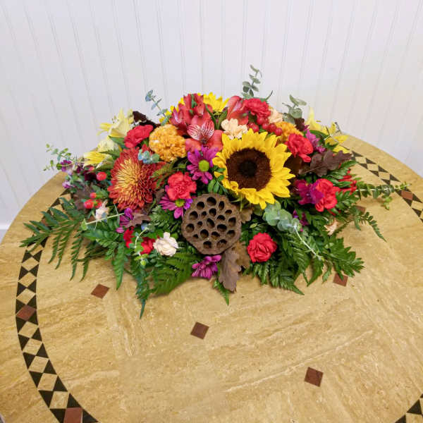Colorful mixed flower arrangement on a round table