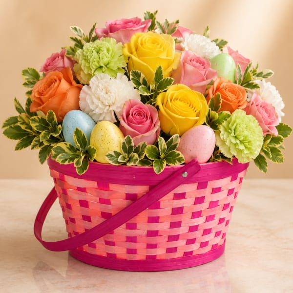 Colorful roses and carnations in a pink basket with pastel eggs