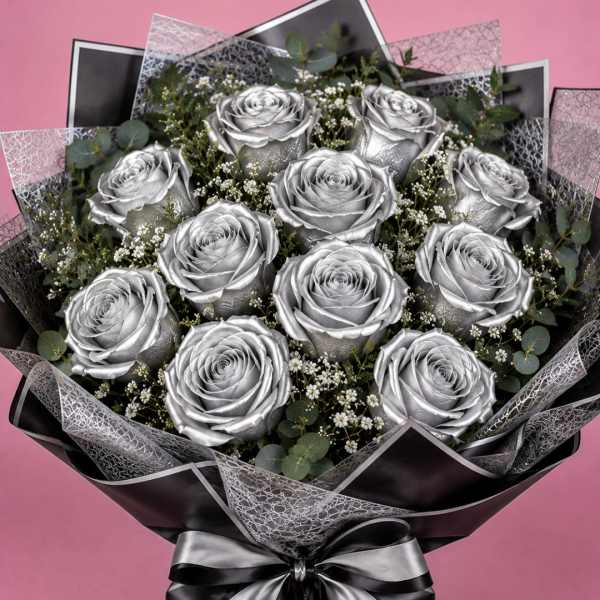Bouquet of silver roses with baby's breath and eucalyptus, wrapped in black paper with a silver ribbon.
