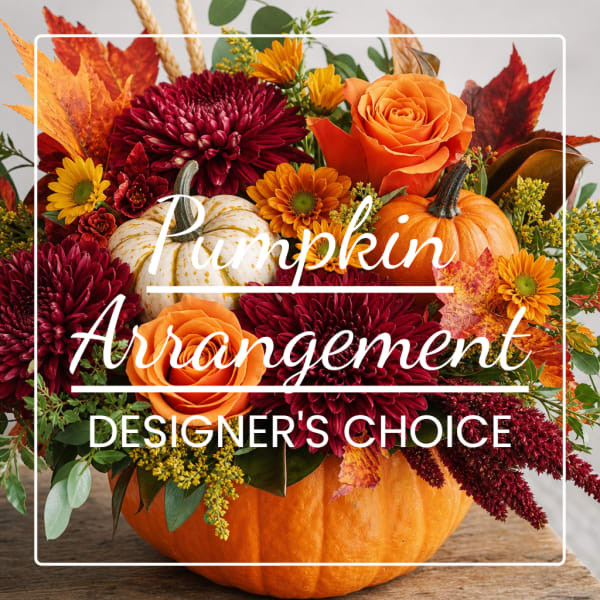 Pumpkin centerpiece with orange roses and burgundy mums