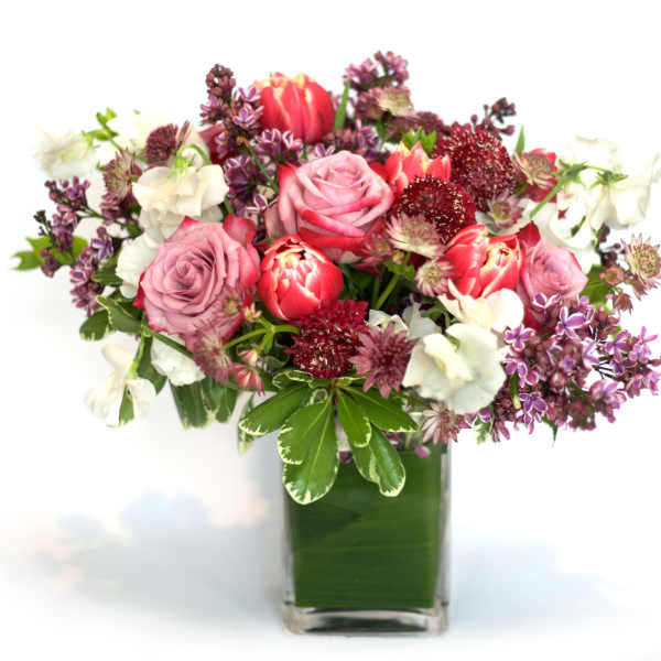 Pink and white mixed bouquet in a clear glass vase