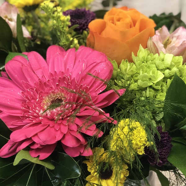 Bright mixed bouquet with a pink gerbera daisy and orange rose