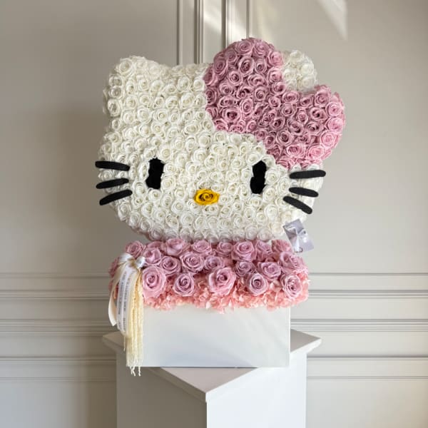 Hello Kitty floral arrangement in a white box with pink and white roses