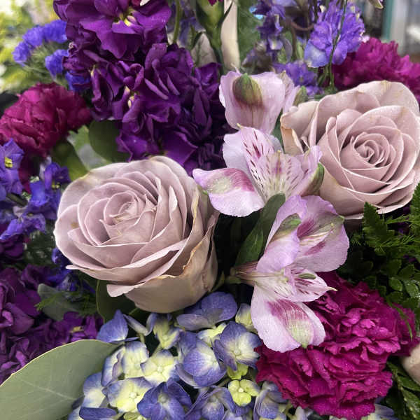 Bouquet of lavender roses, purple flowers, and blue hydrangea