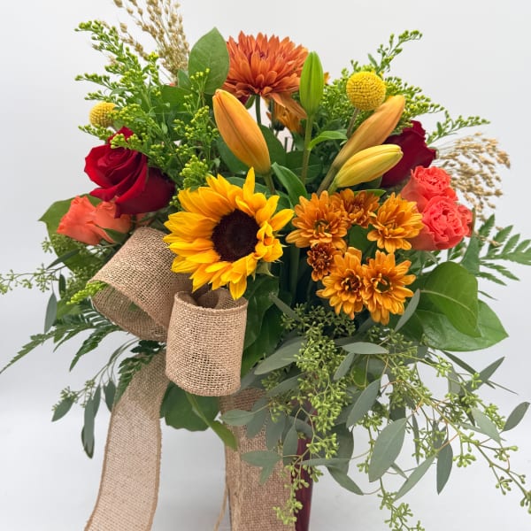 Bouquet of mixed flowers with a burlap ribbon wrap
