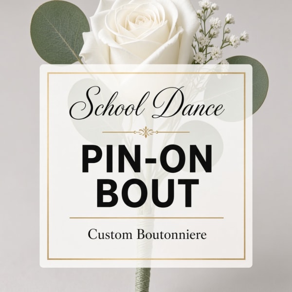 White rose boutonniere with baby's breath and round greenery