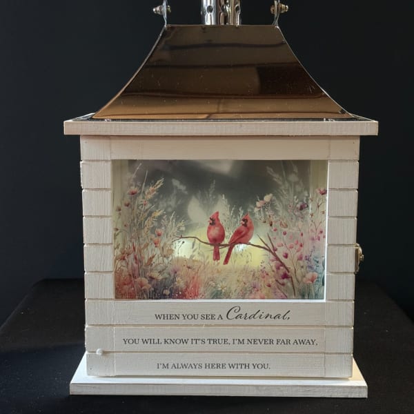 Decorative lantern with a cardinal scene and memorial quote