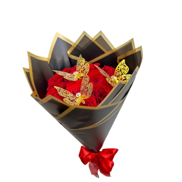 Red rose bouquet wrapped in black and gold paper with a red bow