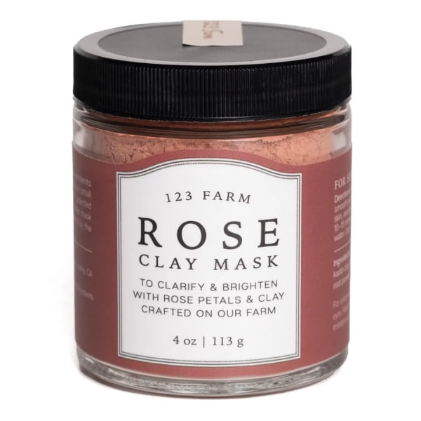 Jar of rose clay mask with a black lid and pink label