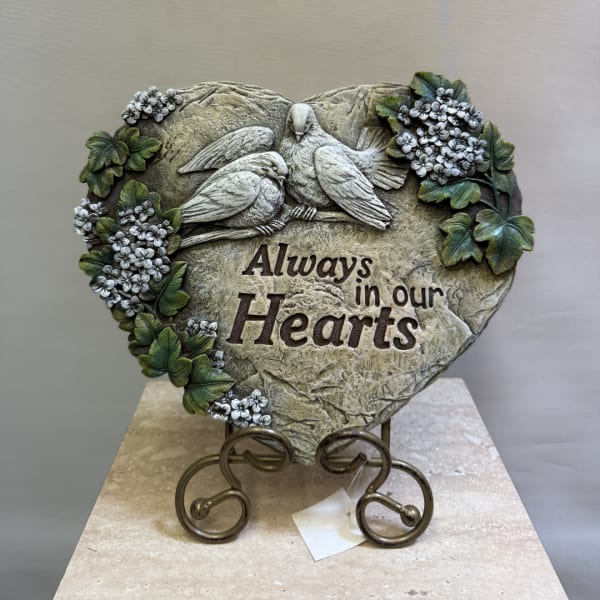 Heart-shaped memorial plaque with two birds and floral accents