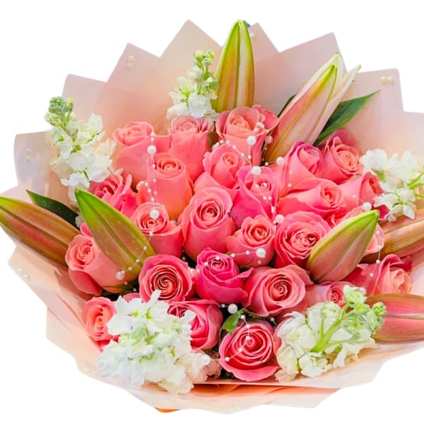 Bouquet of pink roses with white lilies and pale wrapping