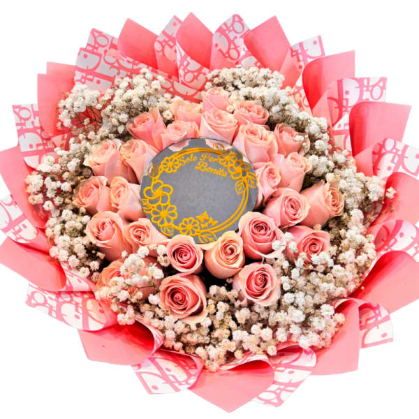Bouquet of pink roses with baby's breath in pink wrapping