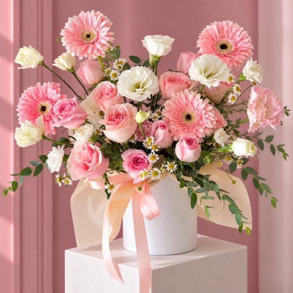 Pink and white mixed bouquet in a white hat box with ribbon