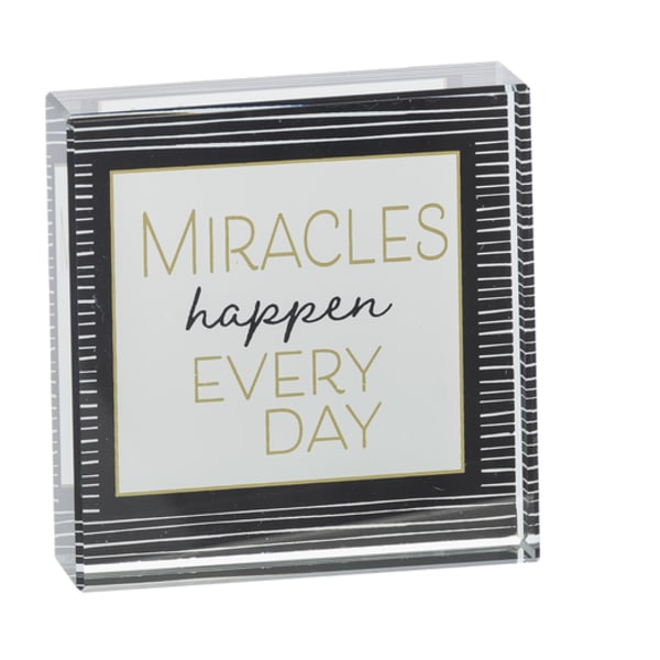 Decorative sign with the words "Miracles happen every day"