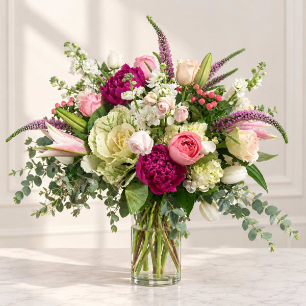 Mixed pink and white bouquet in a clear glass vase