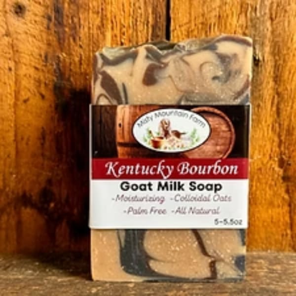 Bar of Kentucky Bourbon goat milk soap in printed packaging