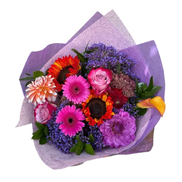 Colorful bouquet with gerbera daisies, roses, and calla lilies in purple wrap