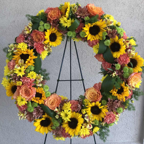 Sunflowers, mums, roses, carnations and greenery