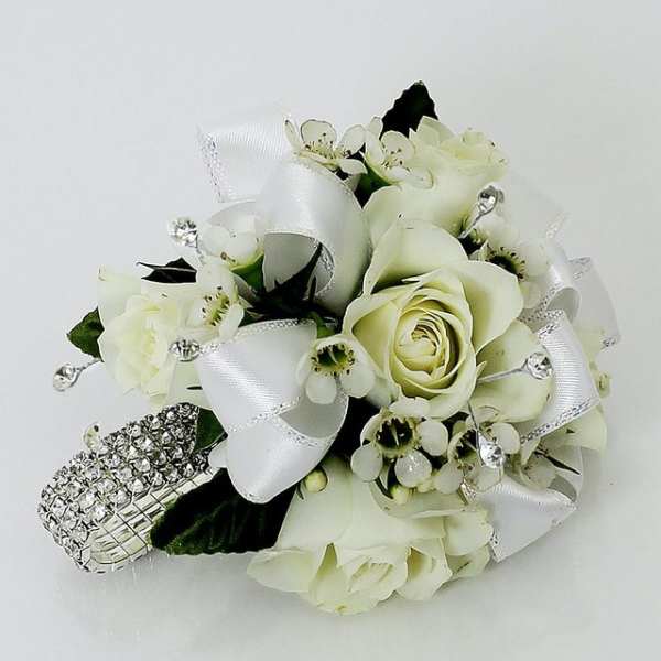 White rose corsage with ribbon and rhinestone accents