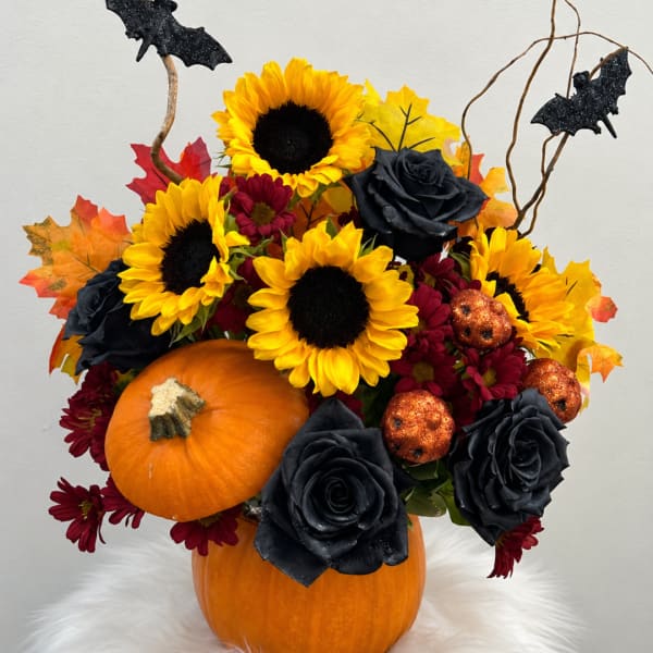 Halloween bouquet with sunflowers, black roses, and pumpkins