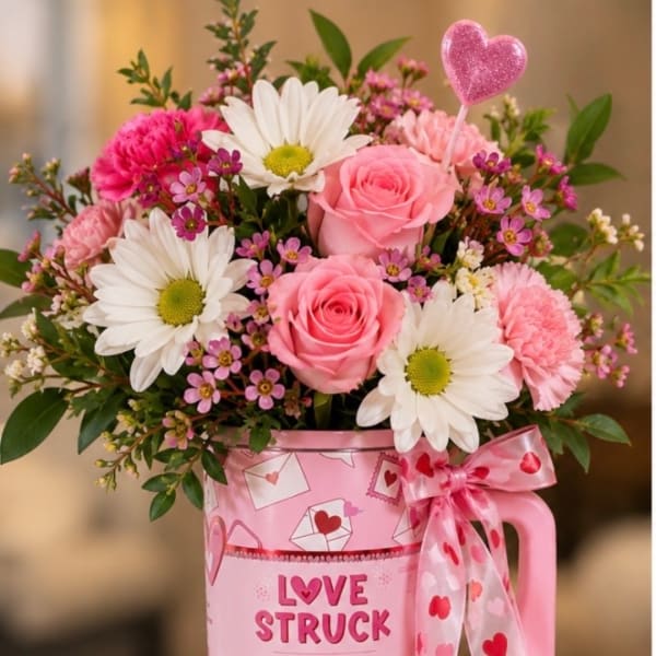 Pink and white bouquet in a pink mug with a heart ribbon