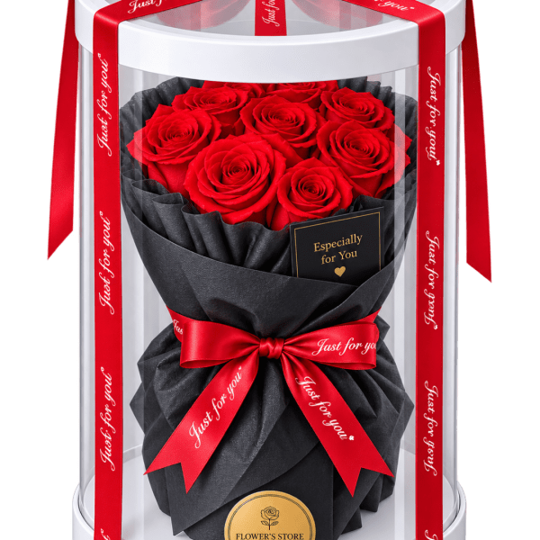 Red roses in a black wrapped bouquet inside a clear gift box with red ribbons.