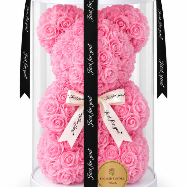 Pink rose teddy bear in a clear display box with ribbon bows