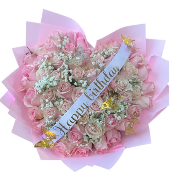 Pink rose bouquet with a birthday ribbon and butterfly decorations
