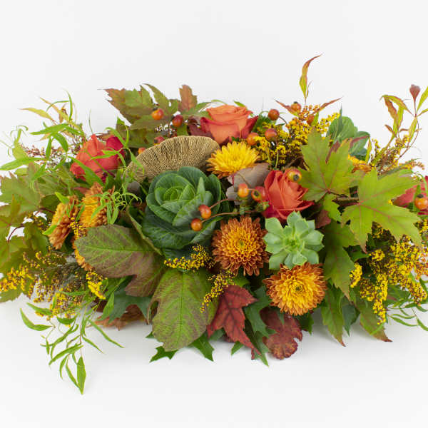 Autumn floral arrangement with orange roses and yellow mums
