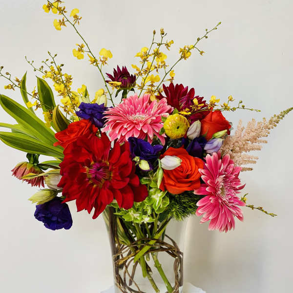 Colorful mixed bouquet in a clear glass vase