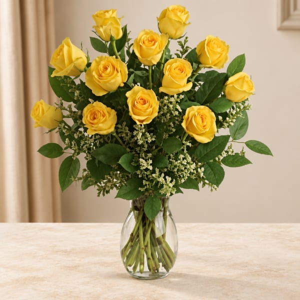 Yellow roses arranged in a clear glass vase