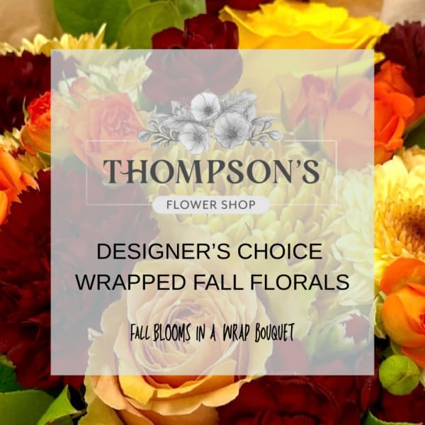 Wrapped bouquet of fall-colored flowers with a shop logo and text overlay