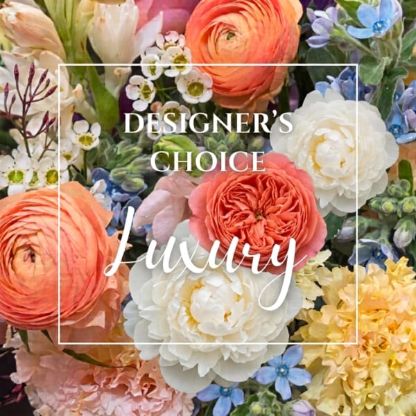 Mixed bouquet with coral, white, yellow, and blue flowers