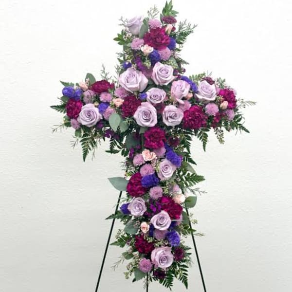 Cross-shaped floral spray with lavender roses and purple blooms