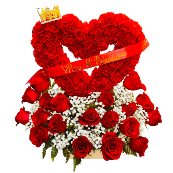 Red heart-shaped floral arrangement with roses and a crown topper