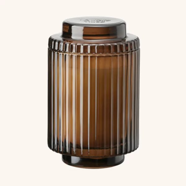Amber ribbed glass candle jar with a lid