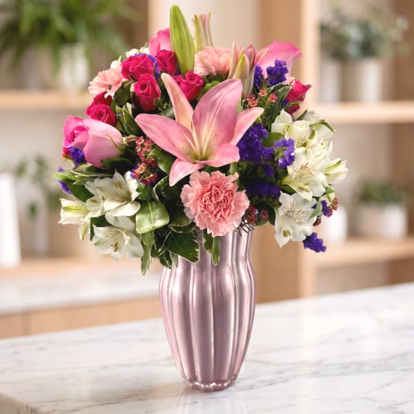 Pink and white mixed bouquet in a pink vase