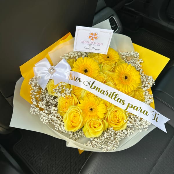 Yellow rose and gerbera bouquet with baby's breath and a white ribbon