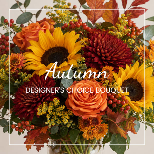 Autumn bouquet with sunflowers, orange roses, and red mums