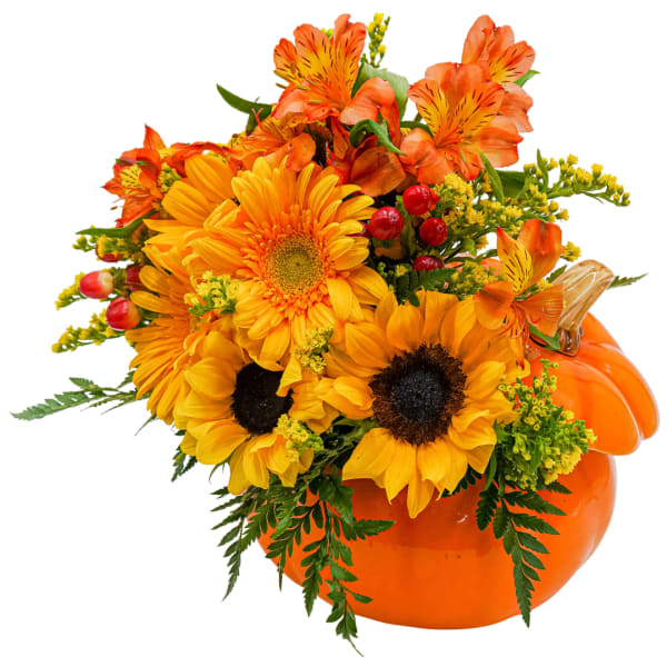 Orange and yellow floral arrangement in a pumpkin-shaped container