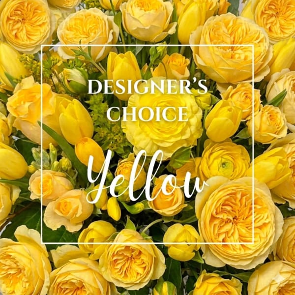 Yellow roses and tulips arranged in a dense bouquet