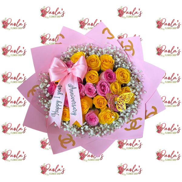 Pink and yellow rose bouquet with a satin bow and anniversary ribbon