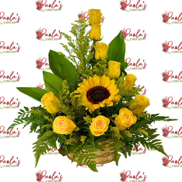 Yellow roses and a sunflower in a basket arrangement