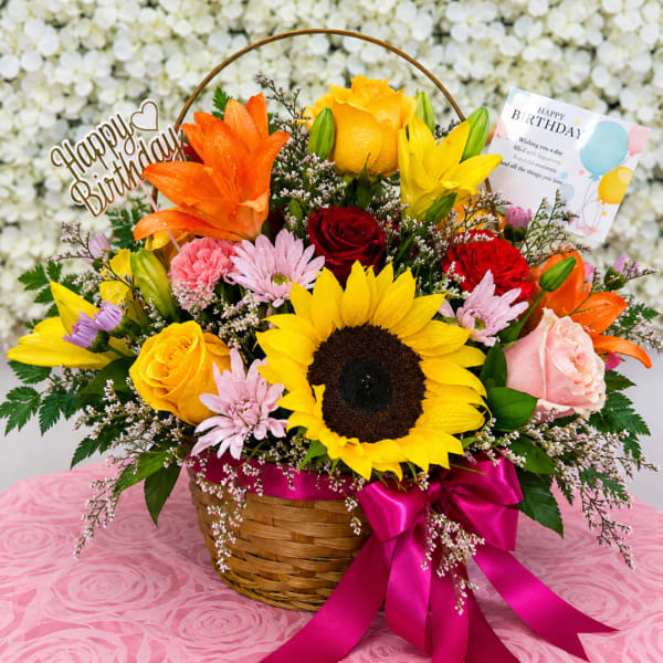 Colorful mixed flower basket with a birthday sign and card