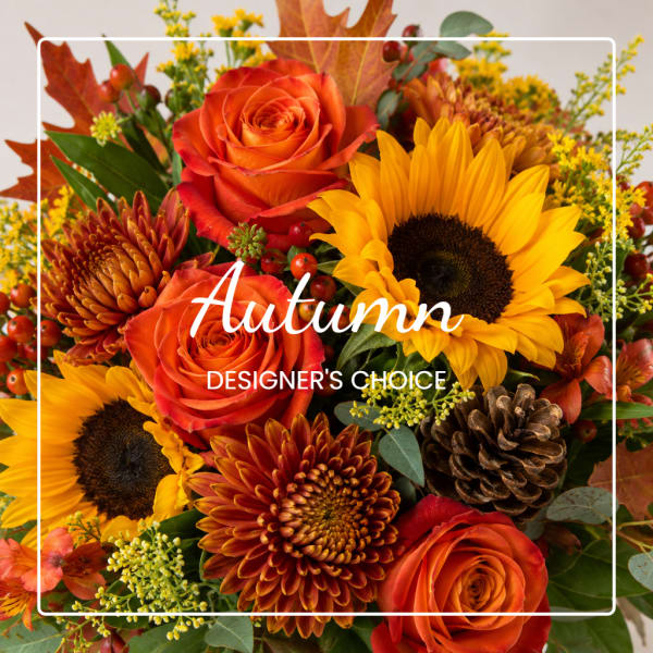 Autumn bouquet with orange roses, sunflowers, and mums